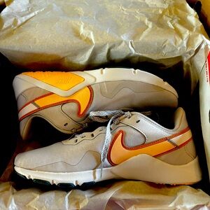 NIB NIKE Legend Essentials 2 size 7.5 Peach/White